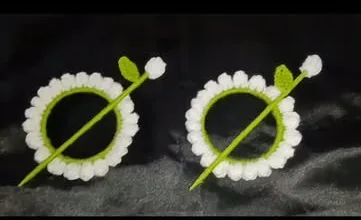 Two crochet daisy bun sticks with green pins